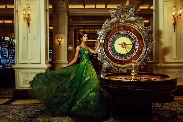 2G777 Casino Games — Enjoy nonstop entertainment A close-up shot of golden coins falling around a spinning roulette wheel, representing immersive casino action at 2G777.